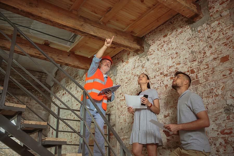 A contractor makes home improvements paid for with a home equity loan.